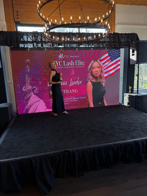 Swan Thang on stage at the NYC Lash Elite Championship