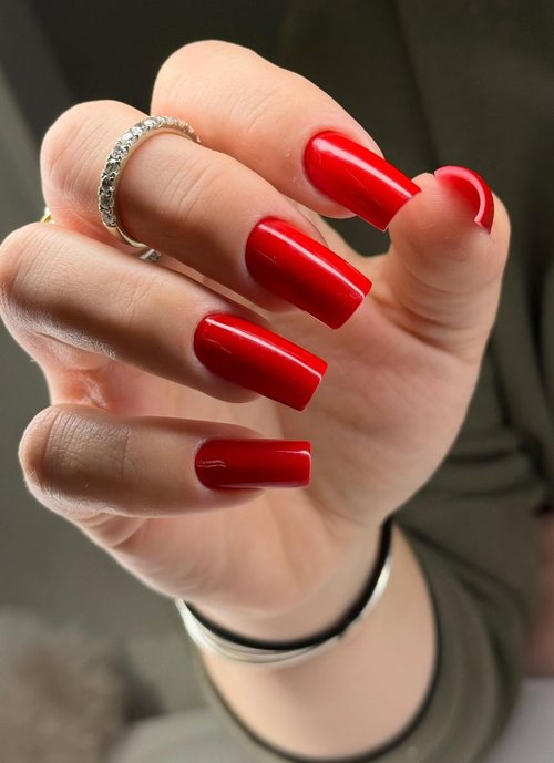 Long red square set styled with a ring
