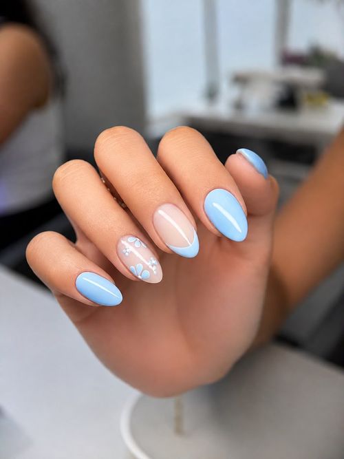 Blue and white nail art on almond nails
